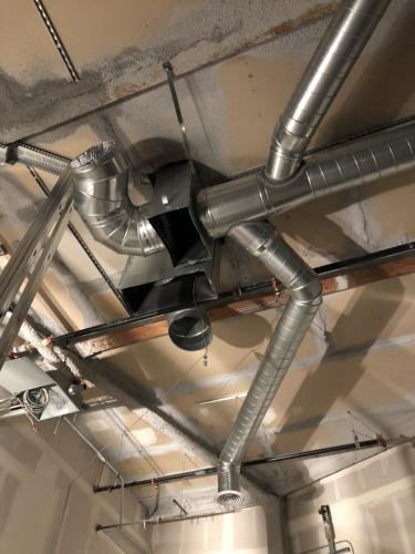 Comercial air ducts installation is in progress in Irvine Spectrum Shopping Center in Irvine in Sep 2019.