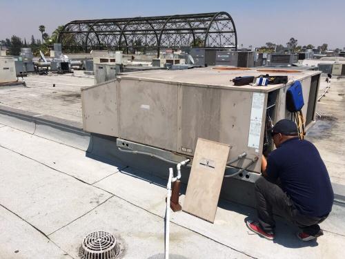 Repairing a 10-ton rooftop, light commercial package heat pump in Sherman Oaks.